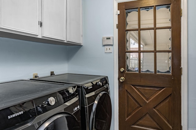 laundry room featuring cabinet space and independent washer and dryer