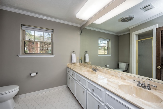 full bath with visible vents, a stall shower, toilet, and a sink
