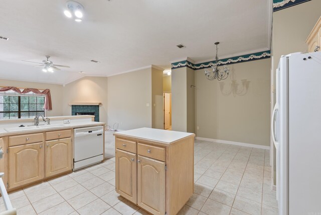 kitchen featuring light brown cabinetry, light countertops, ornamental molding, white appliances, and a sink