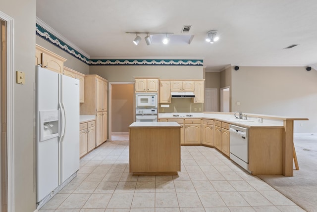 kitchen featuring visible vents, light brown cabinets, crown molding, white appliances, and a sink