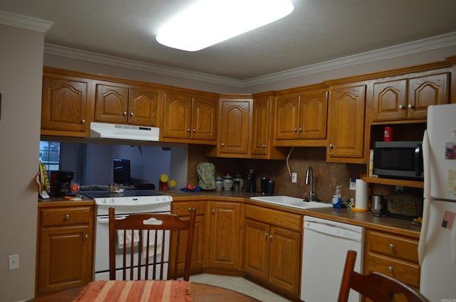 kitchen with under cabinet range hood, white appliances, brown cabinets, and a sink