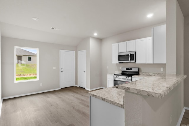 16 Sig Cv, Ward, AR 72176 - kitchen featuring appliances with stainless steel finishes, light wood-style flooring, baseboards, white cabinetry, and recessed lighting