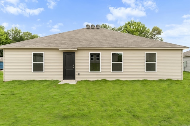 16 Sig Cv, Ward, AR 72176 - rear view of property with a shingled roof and a lawn