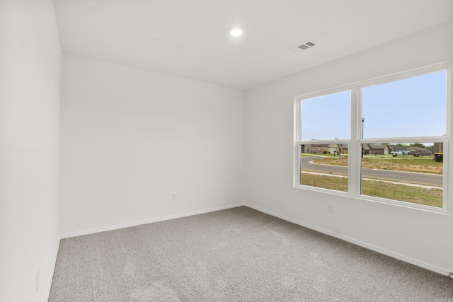 carpeted spare room with baseboards and recessed lighting