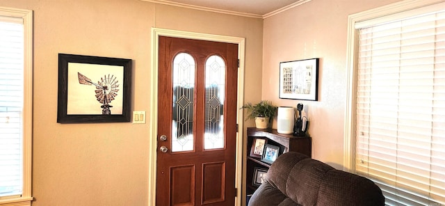 entryway featuring ornamental molding