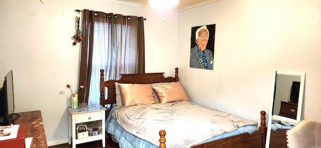 bedroom featuring crown molding