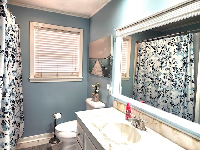 bathroom with vanity, baseboards, ornamental molding, tile patterned floors, and toilet