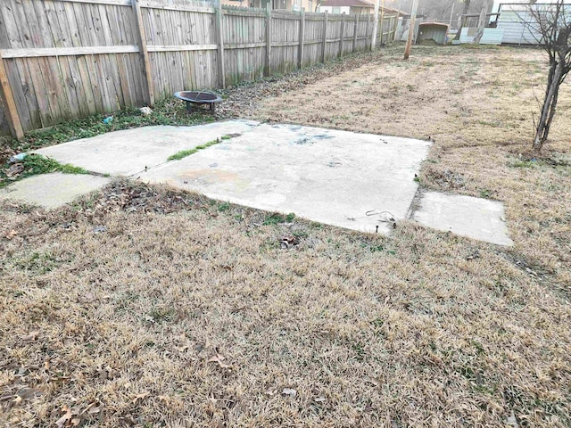 view of yard featuring a patio area and fence