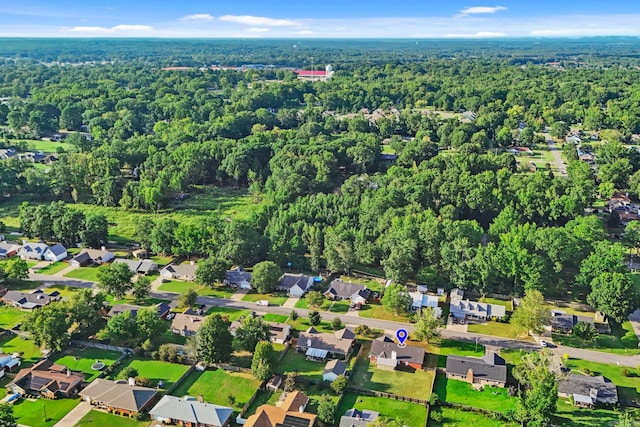 aerial view featuring a residential view and a view of trees