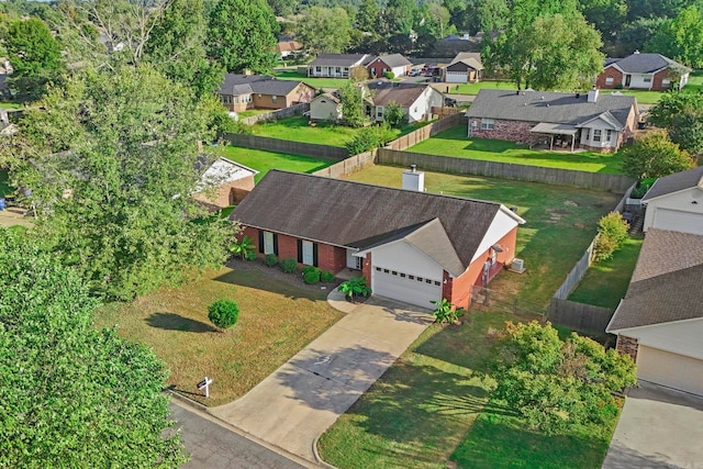 birds eye view of property with a residential view