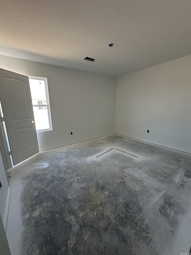 28 Doe Run Dr, Ward, AR 72176 - empty room featuring concrete floors, a textured ceiling, and visible vents