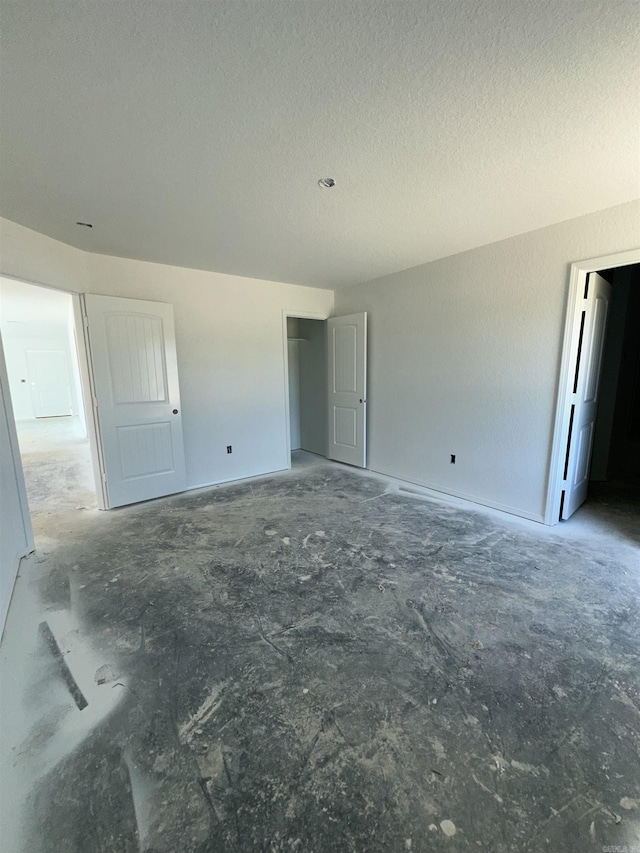 28 Doe Run Dr, Ward, AR 72176 - empty room featuring a textured ceiling