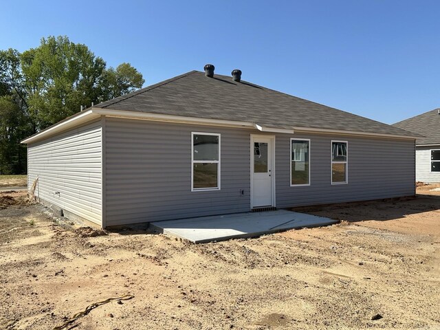 14 Sig Cv, Ward, AR 72176 - back of house featuring roof with shingles and a patio area
