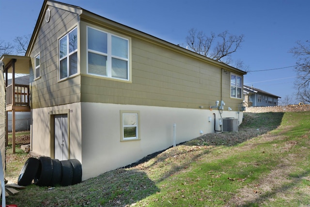 116 Nickels St, Hot Springs, AR 71913 - view of property exterior with stucco siding and central AC unit