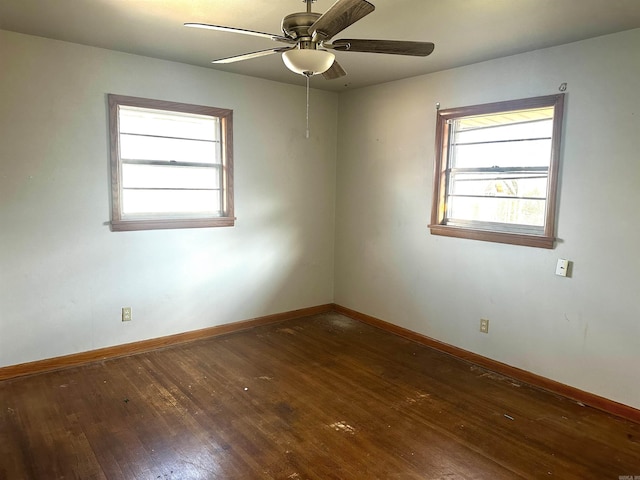 spare room with ceiling fan, baseboards, and hardwood / wood-style floors