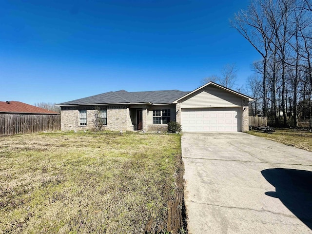 ranch-style house with a front yard, concrete driveway, a garage, and fence