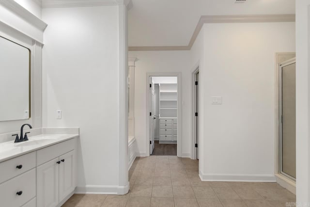 full bathroom with a stall shower, ornamental molding, vanity, and tile patterned flooring