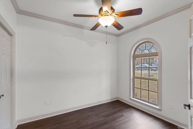 unfurnished room featuring baseboards, dark wood-type flooring, and ornamental molding