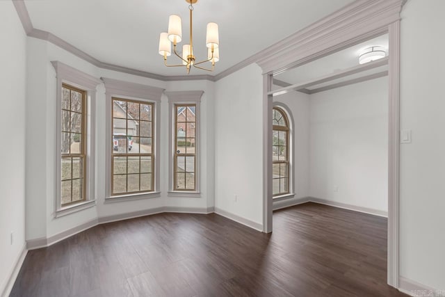 unfurnished dining area featuring a notable chandelier, a healthy amount of sunlight, and wood finished floors