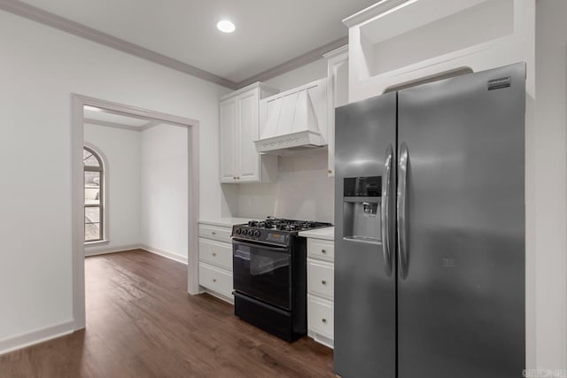 kitchen with dark wood-type flooring, ornamental molding, stainless steel refrigerator with ice dispenser, white cabinets, and gas stove