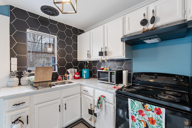 kitchen featuring under cabinet range hood, stainless steel microwave, a sink, black range with electric cooktop, and white cabinets