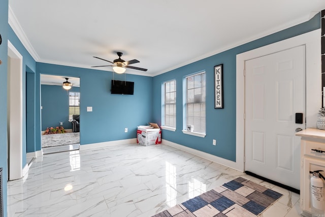 entryway featuring marble finish floor, crown molding, baseboards, and ceiling fan