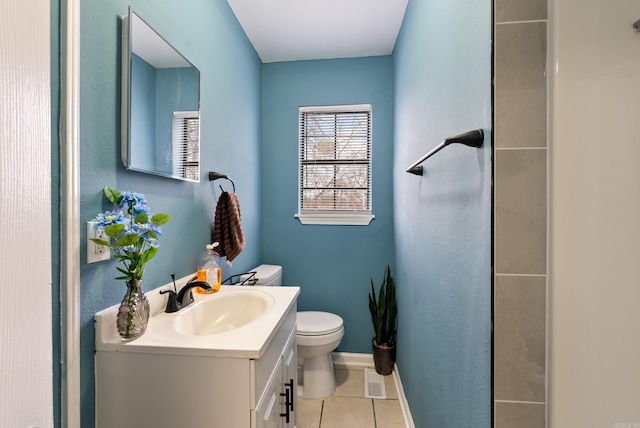 bathroom featuring tile patterned flooring, visible vents, baseboards, toilet, and vanity