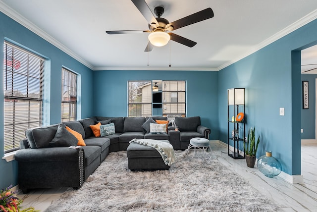 living area featuring marble finish floor, baseboards, crown molding, and a healthy amount of sunlight