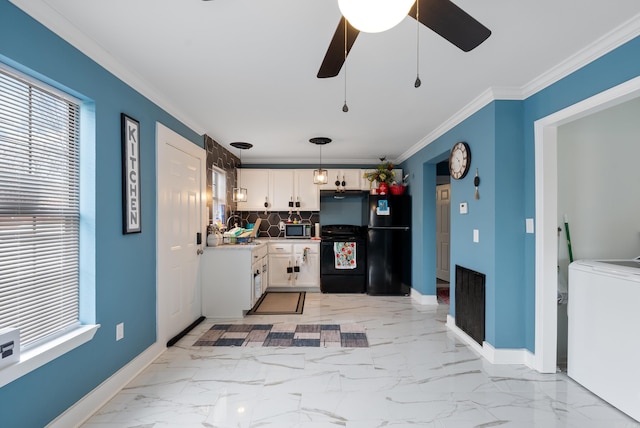 kitchen with washer / dryer, freestanding refrigerator, ornamental molding, white cabinets, and marble finish floor