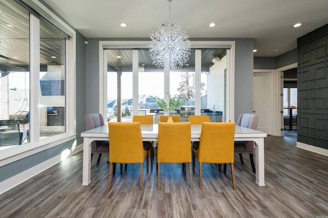 dining area featuring recessed lighting, baseboards, and wood finished floors