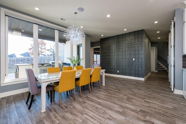 dining room featuring visible vents, recessed lighting, baseboards, and wood finished floors