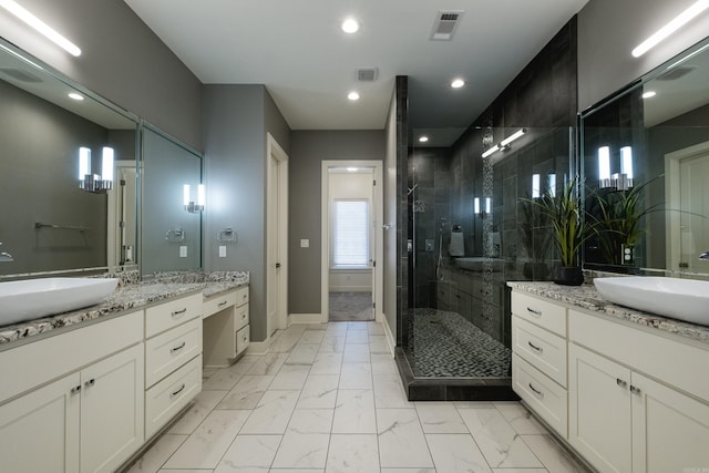 full bathroom with a stall shower, visible vents, marble finish floor, and a sink