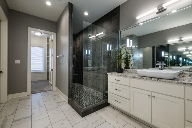 bathroom with vanity, baseboards, recessed lighting, a stall shower, and marble finish floor