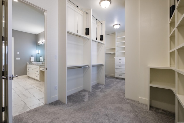 spacious closet with marble finish floor