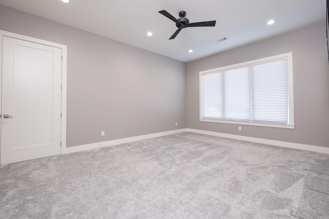 empty room featuring recessed lighting, visible vents, and carpet floors