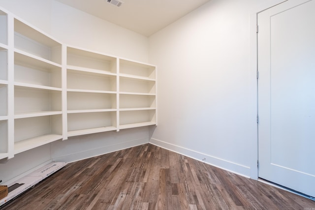 interior space featuring visible vents and a baseboard heating unit