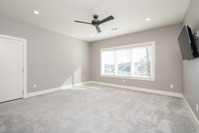 unfurnished room with visible vents, recessed lighting, baseboards, and carpet floors