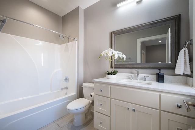 bathroom with vanity, toilet, and tub / shower combination