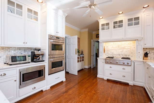 kitchen featuring white cabinets and appliances with stainless steel finishes