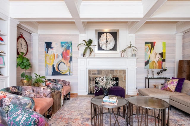 living room with beam ceiling, a fireplace, coffered ceiling, and crown molding