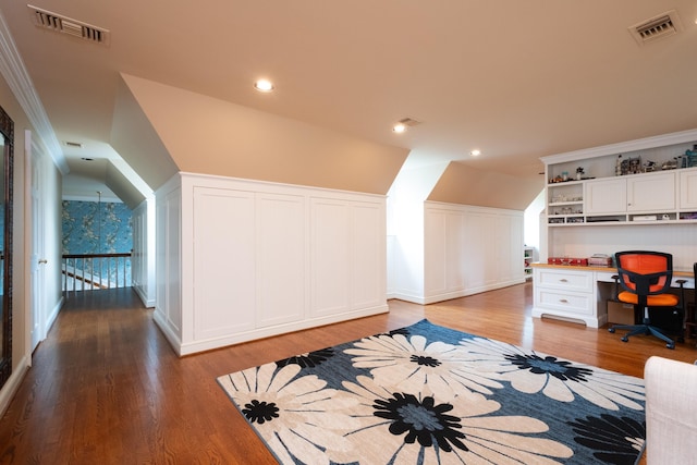 office area with recessed lighting, visible vents, a decorative wall, and light wood finished floors