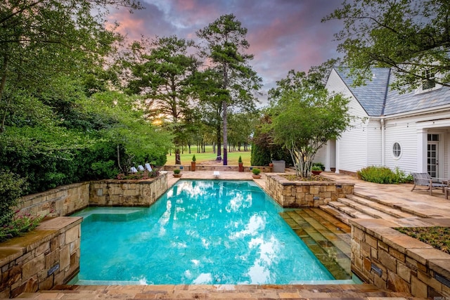 outdoor pool featuring a patio