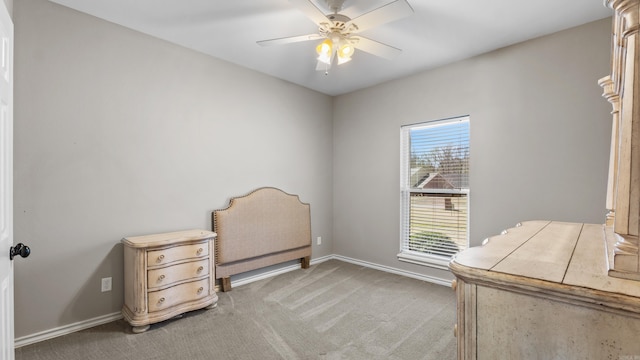 bedroom with light carpet, a ceiling fan, and baseboards