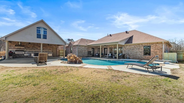 view of swimming pool featuring a patio area, fence, a ceiling fan, and a diving board