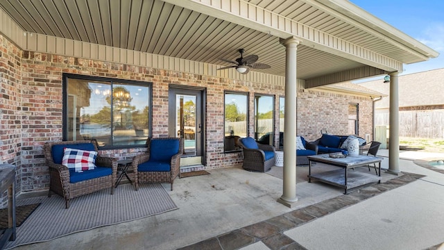 view of patio featuring a ceiling fan, outdoor lounge area, and fence