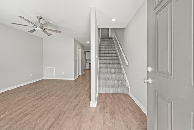 stairs featuring visible vents, wood finished floors, recessed lighting, baseboards, and ceiling fan