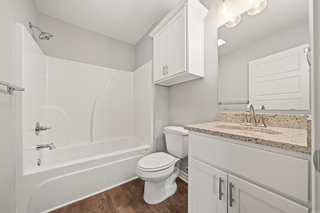 full bathroom featuring vanity, wood finished floors, visible vents, bathtub / shower combination, and toilet