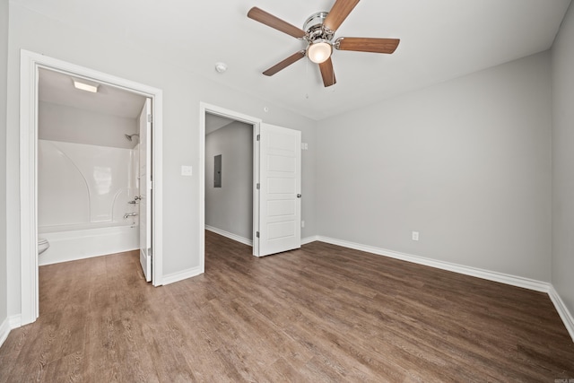 unfurnished bedroom with a ceiling fan, baseboards, and wood finished floors