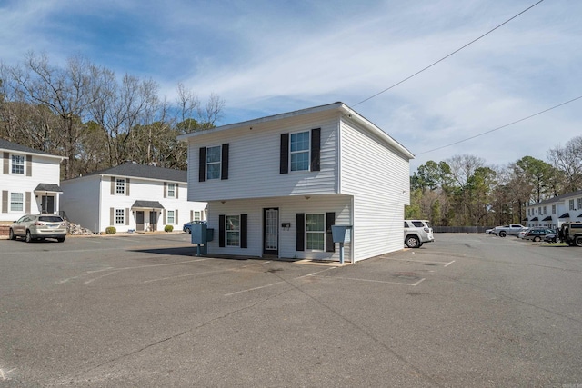 view of front of home featuring uncovered parking