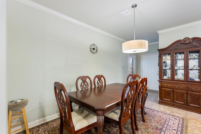 dining space featuring visible vents, baseboards, ornamental molding, and light tile patterned flooring